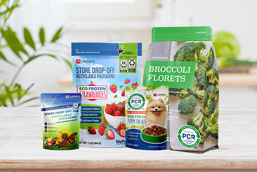 Assortment of sustainable Layfield flexible packaging including store drop-off recyclable and PCR-content pouches for strawberries, broccoli, and pet food.