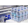 Shrink-wrapped pack of water bottles using collation film on a production line